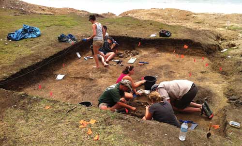 Trench 592, excavating human remains. Photo by Scott Fitzpatrick.